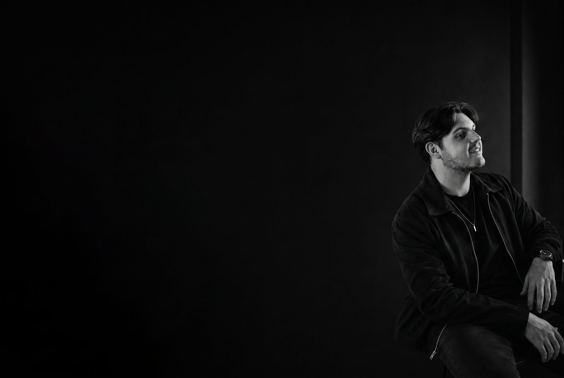 Corey, founder of Maison Media Group, photographed in a dark studio
